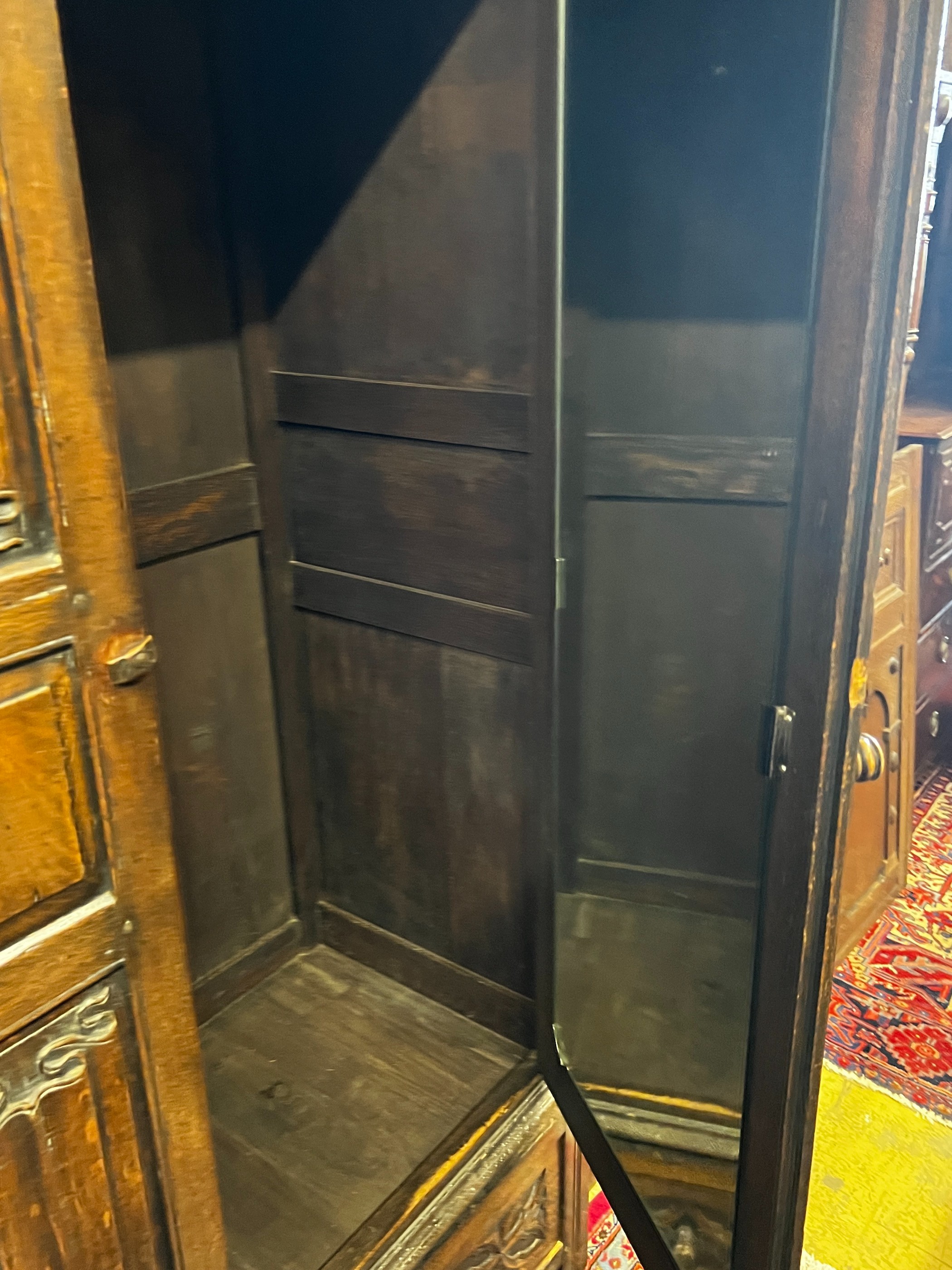 An 18th century style oak linenfold moulded wardrobe, width 123cm, depth 53cm, height 185cm